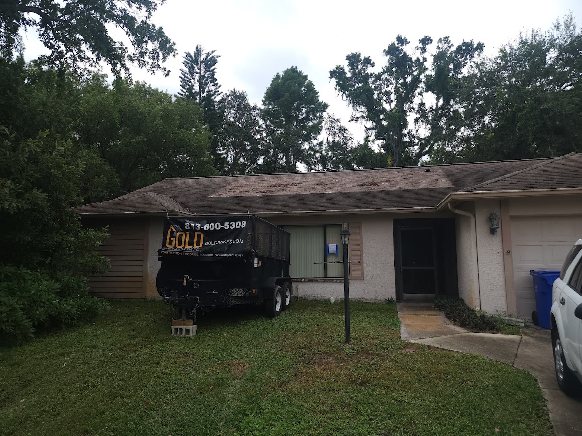 Gold Roofs branded work trailer