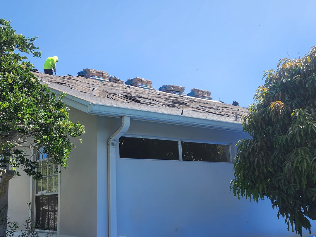 Roofing materials and a roofer at work